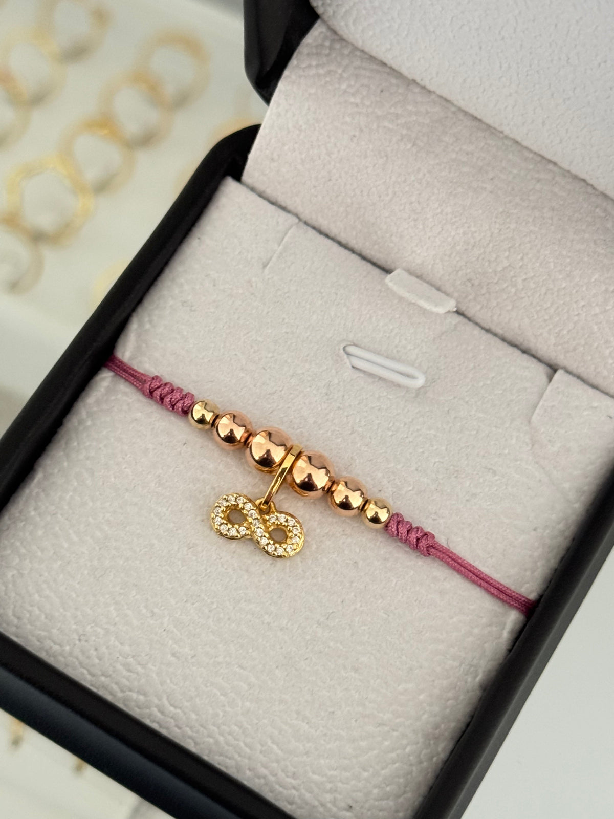 Pulsera infinito circonia oro rosa
